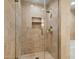 Shower with glass doors, tiled surround and built in niche for convenient storage of bath and shower items at 7167 E Rancho Vista Dr # 4006, Scottsdale, AZ 85251