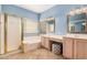 Well-lit bathroom featuring a walk-in shower, tub, and vanity with a vanity chair at 7520 S Jentilly Ln, Tempe, AZ 85283