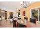 Spacious dining room with an elegant chandelier, hardwood table, and open layout to living spaces at 7520 S Jentilly Ln, Tempe, AZ 85283