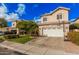 Inviting two-story home with a two-car garage, tile roof, and well-maintained landscaping at 7520 S Jentilly Ln, Tempe, AZ 85283