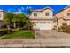 Charming two-story home with a two-car garage, desert landscaping, and a basketball hoop at 7520 S Jentilly Ln, Tempe, AZ 85283