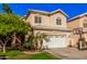 Charming two-story home featuring a two-car garage, tile roof, and mature landscaping at 7520 S Jentilly Ln, Tempe, AZ 85283