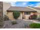 Attractive home showcases desert landscaping including succulents and red flowering shrubs near the entryway at 8055 E Thomas Rd # E106, Scottsdale, AZ 85251