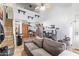 Cozy living room featuring an open kitchen concept with stainless steel appliances and hardwood floors at 8055 E Thomas Rd # E106, Scottsdale, AZ 85251