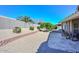 A spacious backyard with gravel, stone accents, and lush landscaping at 8444 W Rockwood Dr, Peoria, AZ 85382