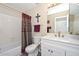 Bathroom featuring modern fixtures, including a shower-tub combo and vanity at 8444 W Rockwood Dr, Peoria, AZ 85382