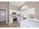 Bright kitchen with white cabinets, stainless steel appliances, and marble countertops at 8444 W Rockwood Dr, Peoria, AZ 85382