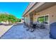 Relaxing covered patio with seating and a well-maintained outdoor area at 8444 W Rockwood Dr, Peoria, AZ 85382