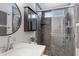 Updated bathroom featuring a glass enclosed shower and vanity at 8556 E Pecos Ln, Scottsdale, AZ 85250