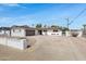 Well-maintained home featuring a circular driveway, attached garage, xeriscaping and mature landscaping at 8556 E Pecos Ln, Scottsdale, AZ 85250