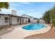 Beautiful backyard with a refreshing pool, perfect for outdoor entertaining, complemented by a charming patio at 8556 E Pecos Ln, Scottsdale, AZ 85250