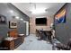 Basement entertaining space with a bar area and a brick accent wall at 868 W Desert Glen Dr, San Tan Valley, AZ 85143