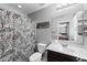 A cozy bathroom features a shower with patterned curtain and a classic vanity at 868 W Desert Glen Dr, San Tan Valley, AZ 85143