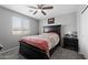 A quaint bedroom features a classic bed frame and a bedside table with decorative accents at 868 W Desert Glen Dr, San Tan Valley, AZ 85143