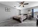 A spacious bedroom with plush carpet is brightened by natural light at 868 W Desert Glen Dr, San Tan Valley, AZ 85143