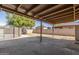 Large back yard with a covered patio and a block wall at 8816 W Catalina Dr, Phoenix, AZ 85037