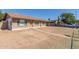 Home exterior showing the charming brick facade, covered parking, and low maintenance front yard at 8816 W Catalina Dr, Phoenix, AZ 85037