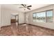 Spacious living room with a large window offering plenty of natural light and tile flooring at 8816 W Catalina Dr, Phoenix, AZ 85037