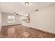 Bright living room showcasing tile floors, neutral paint, and natural light from a large window at 8816 W Catalina Dr, Phoenix, AZ 85037