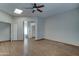 Bedroom with ceiling fan, skylight, and ensuite bathroom at 934 E Carlise Rd, Phoenix, AZ 85086