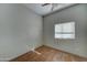 Bedroom with wood floor, ceiling fan, and a window allowing for natural light at 934 E Carlise Rd, Phoenix, AZ 85086