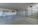 Garage with a utility sink and room for two vehicles with white concrete floors at 934 E Carlise Rd, Phoenix, AZ 85086