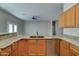 Bright kitchen featuring granite countertops, stainless steel appliances, and ample storage space in wood cabinetry at 934 E Carlise Rd, Phoenix, AZ 85086