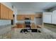 Bright kitchen featuring granite countertops, stainless steel appliances, and ample storage space in wood cabinetry at 934 E Carlise Rd, Phoenix, AZ 85086