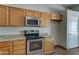 Bright kitchen featuring granite countertops, stainless steel appliances, and ample storage space in wood cabinetry at 934 E Carlise Rd, Phoenix, AZ 85086