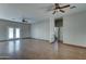 Living room featuring wood flooring, ceiling fan, and French doors leading to the backyard at 934 E Carlise Rd, Phoenix, AZ 85086