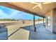 Relaxing covered patio featuring a ceiling fan for comfort and great views of the surrounding landscape at 934 E Carlise Rd, Phoenix, AZ 85086