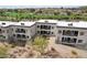 Aerial view of condo complex with golf course and mountain views at 10401 N Saguaro Blvd # 104, Fountain Hills, AZ 85268