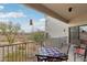 Relaxing balcony features wrought iron furniture and desert views at 10401 N Saguaro Blvd # 104, Fountain Hills, AZ 85268