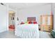 Bright bedroom with white walls, decorative accents, closet, and a light-colored wood dresser at 10401 N Saguaro Blvd # 104, Fountain Hills, AZ 85268