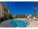 Private hot tub with lounge chairs and desert landscaping at 10401 N Saguaro Blvd # 104, Fountain Hills, AZ 85268