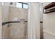 Bathroom featuring new shower with tile and rainfall shower head at 10401 N Saguaro Blvd # 104, Fountain Hills, AZ 85268