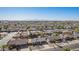 Inviting single-story residence with desert landscaping, driveway, and palm trees, nestled in a tranquil neighborhood at 10533 W Lawrence Ln, Peoria, AZ 85345