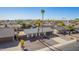 Scenic aerial shot of a charming home in a tranquil residential area, adorned with mature palm trees at 10533 W Lawrence Ln, Peoria, AZ 85345