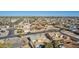 Expansive aerial view of a suburban neighborhood with single-Gathering homes, palm trees, and clear blue skies at 10533 W Lawrence Ln, Peoria, AZ 85345