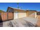 The backyard features a white door with a concrete patio on the side of the house at 10533 W Lawrence Ln, Peoria, AZ 85345