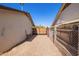 Backyard features gravel on the side of the house leading to a gated area at 10533 W Lawrence Ln, Peoria, AZ 85345