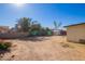 Spacious backyard with a storage shed surrounded by dirt landscaping at 10533 W Lawrence Ln, Peoria, AZ 85345
