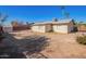 Backyard features a storage shed with dirt landscaping and some greenery at 10533 W Lawrence Ln, Peoria, AZ 85345