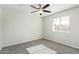 Bright bedroom with a ceiling fan, window with blinds and neutral carpet flooring at 10533 W Lawrence Ln, Peoria, AZ 85345