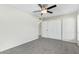 Spacious bedroom with carpet, ceiling fan, and large closet provide a comfortable living space at 10533 W Lawrence Ln, Peoria, AZ 85345