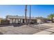 Inviting single-story home with a well-manicured yard, large windows, and an attached garage for convenient living at 10533 W Lawrence Ln, Peoria, AZ 85345