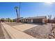 Beautiful single-story home with a driveway and attached garage. Desert-style landscaping at 10533 W Lawrence Ln, Peoria, AZ 85345