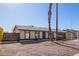 Single-story house with desert landscaping and a driveway leading to the attached garage at 10533 W Lawrence Ln, Peoria, AZ 85345