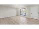 Bright, spacious living area with tiled flooring and a large window providing natural light at 10533 W Lawrence Ln, Peoria, AZ 85345