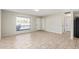 Bright living space featuring tiled flooring, a window view, and multiple entryways at 10533 W Lawrence Ln, Peoria, AZ 85345